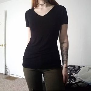 Black V-neck t-shirt.